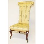 A PAIR OF VICTORIAN WALNUT PRIE DIEUS, each covered in matching yellow fabric with tree design,