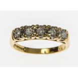 A FIVE STONE DIAMOND RING, 
on 18 ct gold  mounted band, with five stones in a line, 0.