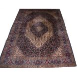 A PERSIAN MOUD RUG, 
with centre hexagonal floral medallion, on an ivory ground and ivory spandrels,