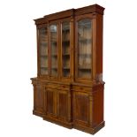 A LATE VICTORIAN FOUR DOOR MAHOGANY BREAKFRONT LIBRARY BOOKCASE,