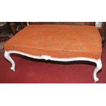 A LARGE VICTORIAN STYLE WHITE PAINTED STOOL, 
with padded top on four cabriole legs, 52in (132cm).