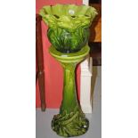 A BRETBY ENGLISH CERAMIC JARDINIERE AND STAND, 
both green glazed and leaf moulded in relief,