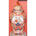 A LARGE PAIR OF JAPANESE BALUSTER SHAPED JARS AND COVERS,
decorated with vases and flowers,