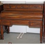 A 19TH CENTURY MAHOGANY CYLINDER DESK, 
with three upper drawers,