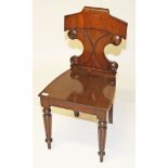 A WILLIAM IV PERIOD MAHOGANY HALL CHAIR, 
with double sea scroll back, above a solid seat,