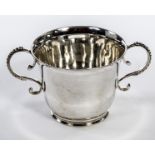 A TWO HANDLED IRISH SILVER CUP, 
by West & Son Dublin 1916, with scroll handles, 22.75in (7cm) 143g.
