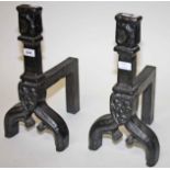 A PAIR OF HEAVY GOTHIC STYLE CAST IRON ANDIRONS, 
each with armorial shield shaped panel,