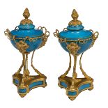 A VERY FINE PAIR OF FRENCH SEVRE STYLE CELESTE BLUE PORCELAIN URNS AND COVERS,