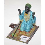 A COLD PAINTED BRONZE FIGURE, 
modelled as an Arab kneeling on a prayer rug, 5.5in (14cm).