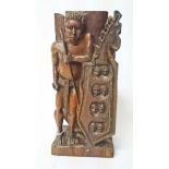 AN AFRICAN TRIBAL WOODEN CARVING, 
depicting two warriors back to back,