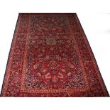A PERSIAN KASHAN RUG, 
with attractive floral field, inside a conforming floral border,