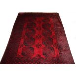 A TURKOMAN ERSARI RUG, 
dark burgundy ground with two rows of octagons inside a multi banded border,