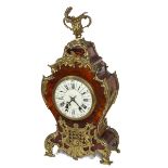 A FRENCH GILT BRASS MOUNTED AND TORTOISE SHELL MANTLE CLOCK,
of asymmetrical cartouche shape,