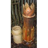 TWO TERRACOTTA CHIMNEY POTS, 
one with reeded cylindrical body an crown top,