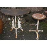 A CIRCULAR CAST IRON PATIO OR GARDEN TABLE, 
with marble top and tri-pod base,