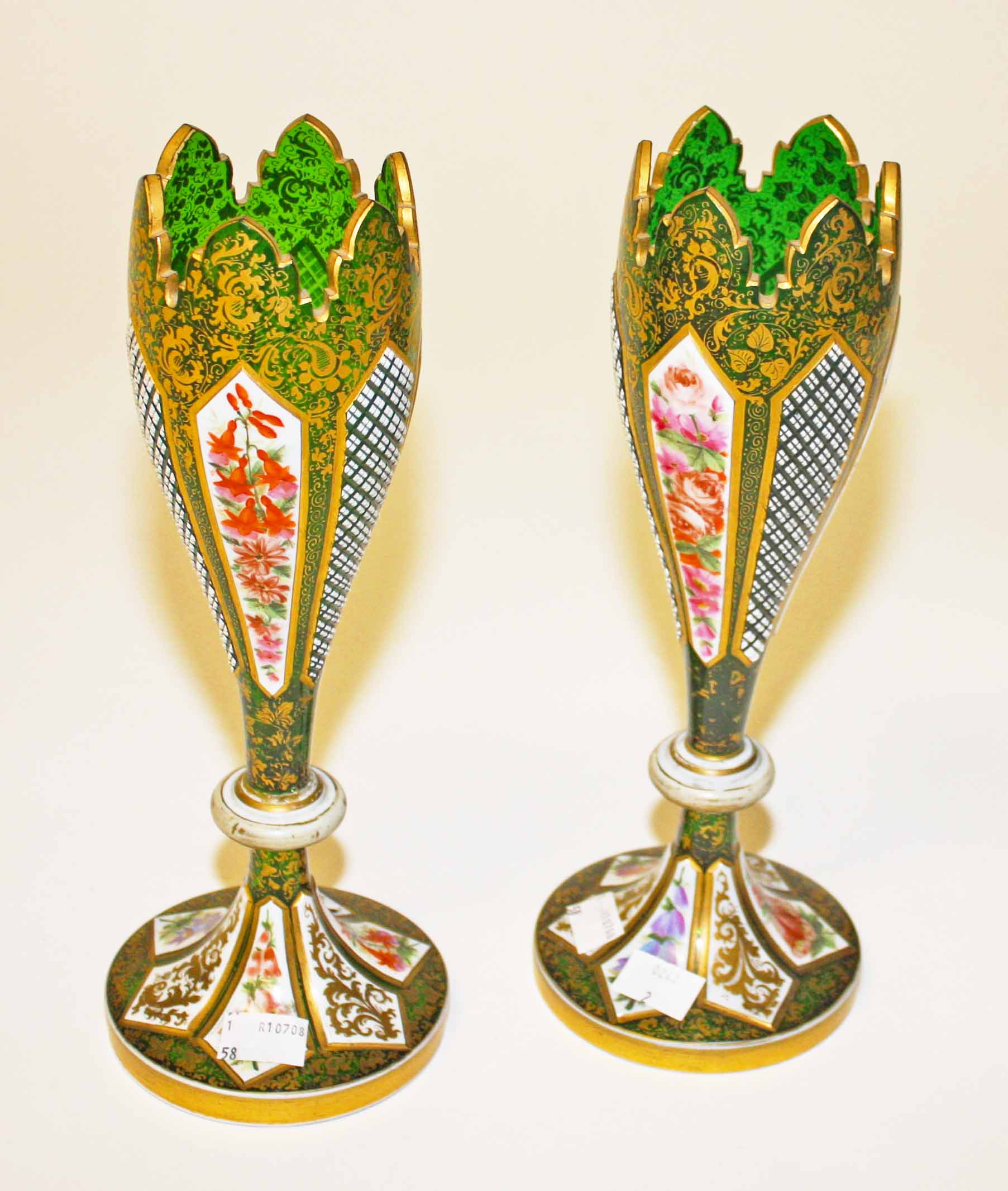 A PAIR OF ATTRACTIVE GREEN BOHEMIAN GLASS VASES, 
19th century, each with floral decorated panels,