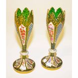 A PAIR OF ATTRACTIVE GREEN BOHEMIAN GLASS VASES, 
19th century, each with floral decorated panels,