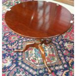 A 19TH CENTURY CIRCULAR MAHOGANY FLIP TOP CENTRE TABLE, 
on turned stem with spiral reeded knop,