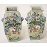 A PAIR OF SQUARE FORM BALUSTER SHAPED FAMILLE VERTE PORCELAIN VASES, 
decorated with Immortals,