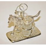 A SILVER PLATED CONDIMENT STAND, 
in the form of a hound carrying a yolk on his back,
