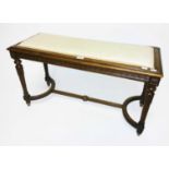 AN OBLONG WALNUT WINDOW STOOL, 
with padded seat above a ribbon moulded frieze,