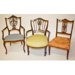 AN EDWARDIAN CARVED AND BONE INLAID MAHOGANY OCCASIONAL ARMCHAIR;