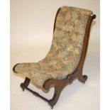 A VICTORIAN WALNUT X-FRAMED OCCASIONAL CHAIR, 
with re-curving button back and seat, on scroll legs,