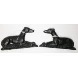 A PAIR OF UNUSUAL IRISH CAST IRON MOUNTS, 
each in the form of a recumbent Irish Wolfhound.