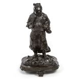 A JAPANESE BRONZE FIGURE, 
modelled as a standing warrior holding a sword,