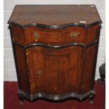 A SERPENTINE FRONTED INLAID AND CROSS BANDED WALNUT SIDE CUPBOARD,