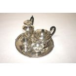 A FIVE-PIECE SILVER PLATED CELTIC STYLE TEA SERVICE, comprising a tea pot, hot water pot, sugar,