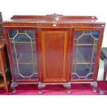 A BREAKFRONT MAHOGANY DISPLAY CABINET, 
with gadroon edge,