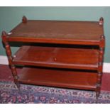 AN EDWARDIAN RECTANGULAR MAHOGANY THREE TIER DUMB WAITER, 
with turned supports, 38in (96cm).