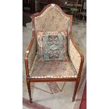 A MAHOGANY AND SATINWOOD BANDED ARMCHAIR,
Edwardian, with arched and padded back,