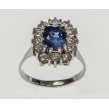 A VERY FINE SAPPHIRE AND DIAMOND RING, 
the centre oval Sapphire approx. 1.