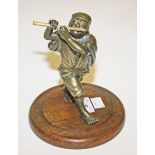 A BRONZE FIGURE, late 19th or early 20th century, modelled as a Chinese boy playing flute,