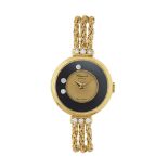 CHOPARD HAPPY DIAMONDS ANNI '90. C. 18K yellow gold with diamond lugs, black bezel with three