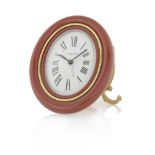 CARTIER SVEGLIETTA ANNI '80. C. oval-shaped gilt brass with red frame. D. white with painted Roman
