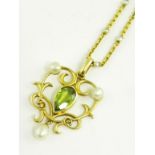 AN ART NOUVEAU PERIDOT, CULTURED PEARL AND GOLD OPENWORK PENDANT ON CONTEMPORARY GOLD NECKLET WITH