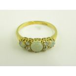 AN OPAL AND DIAMOND RING, IN GOLD, MARKED 18CT, EARLY 20TH C, 3.5G