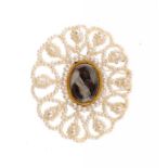 A VICTORIAN SEED PEARL, MOTHER OF PEARL AND GOLD MOURNING BROOCH locket back, in an early 19th c