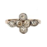 A DIAMOND RING of cruciform design with six old cut cushion shaped diamonds, in gold, stamped