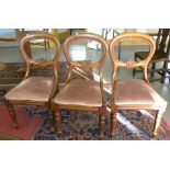 A SET OF THREE VICTORIAN MAHOGANY BALLOON BACK DINING CHAIRS