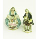 A PAIR OF GERMAN PORCELAIN MINIATURE SEATED FIGURES OF AN 18TH C GALLANT AND LADY