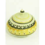 A POOLE POTTERY RED BODIED EARTHENWARE BOWL AND COVER, THE PATTERN PAINTED IN YELLOW AND BLACK