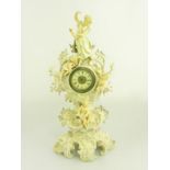 A CONTINENTAL PORCELAIN REVIVED ROCOCO CLOCK CASE, APPLIED WITH VENUS AND THREE PUTTI, GERMAN