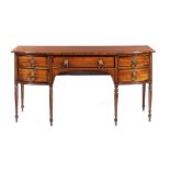 A REGENCY MAHOGANY AND EBONY LINE INLAID BREAKFRONT SIDEBOARD with cellerette drawer and brass