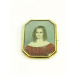 AN OCTAGONAL PORTRAIT MINIATURE WEARING HER HAIR IN RINGLETS, IVORY, MOUNTED IN A GOLD BROOCH WITH