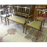 AN EDWARDIAN INLAID AND STAINED BEECH SALON SUITE OF SETTEE AND FOUR CHAIRS
