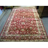 A LUSTROUS WALL RUG WITH RED GROUND